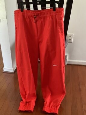 Nike Red Athletic Track Pants with White Swoosh